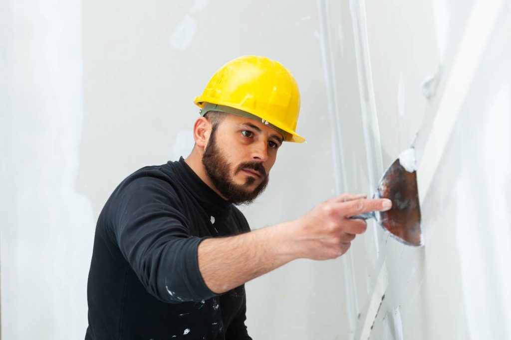 what are the essential tools for a successful plaster wall repair