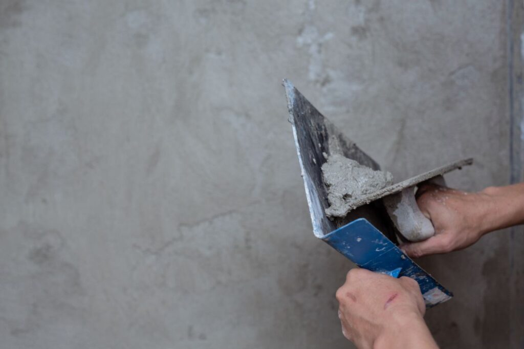 plasterer renovating indoor walls